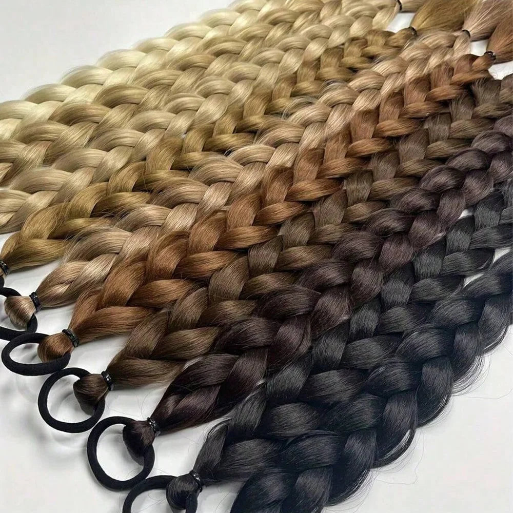 Eine Sammlung von 24-Zoll-synthetischen geflochtenen Pferdeschwanz-Extensions in verschiedenen Blond-, Braun- und Schwarztöne