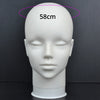 A white professional mannequin head with a measurement line indicating 58cm.