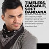 A man wearing a black paisley bandana around his neck, promoting a timeless and durable soft bandana.