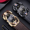 A close-up of a black and gold men's automatic buckle watch and belt with a crocodile pattern.