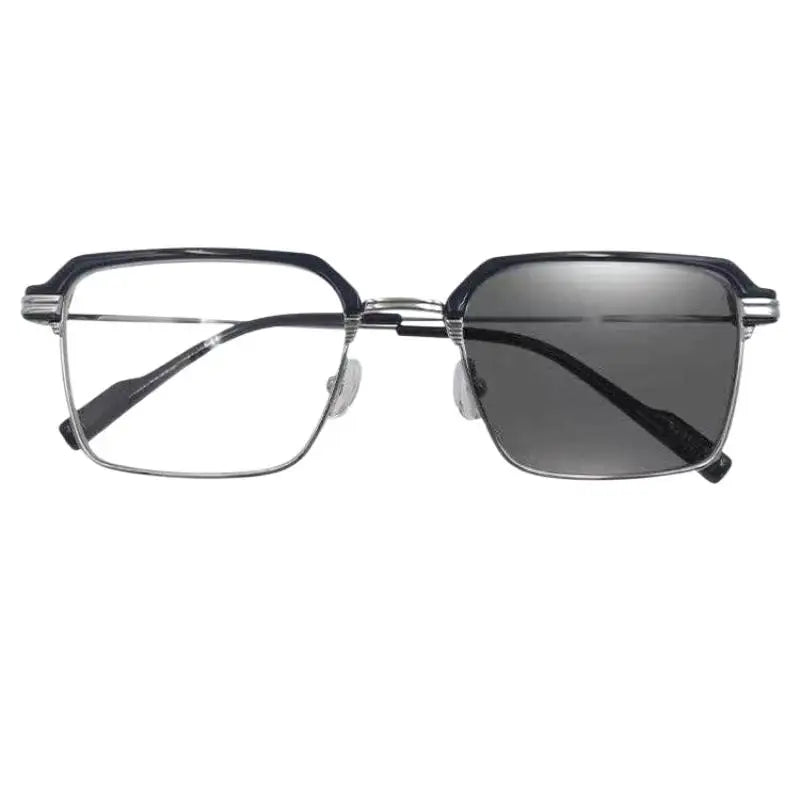 A pair of black photochromic anti-blue light reading glasses with thin metal frames.