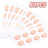 Una hoja de 80 almohadillas nasales anti-resbalantes reutilizables para gafas en color melocotón claro.