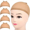 A set of beige high elasticity wig caps and hair netting displayed on a mannequin head.