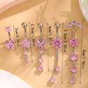 A set of five gold stainless steel dangled belly button rings featuring pink gemstones and various lengths.