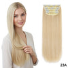 Long, straight blonde hair with a decorative clip attached, shown on a model's shoulder.