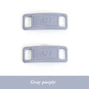 A pair of gray purple diamond shoe charms and laces labeled AF1