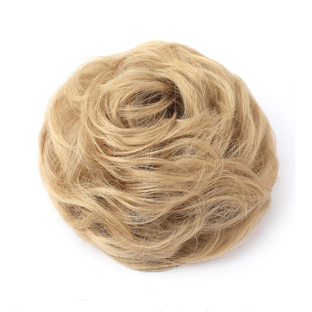 A ball of light blonde hair used as a messy bun hair piece for curly updos
