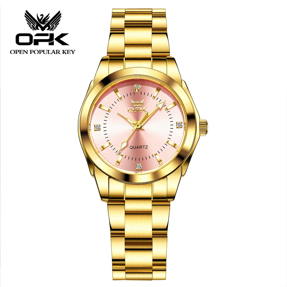 A gold-toned quartz watch with a pink dial and gold accents on a metal bracelet.