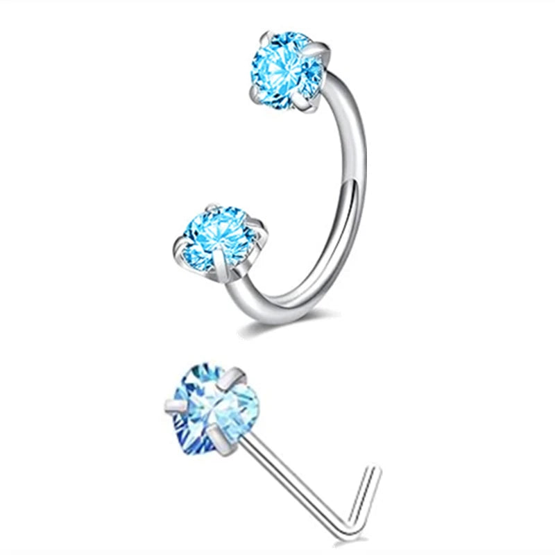 A set of silver horseshoe nose rings featuring sparkling blue cubic zirconia stones.