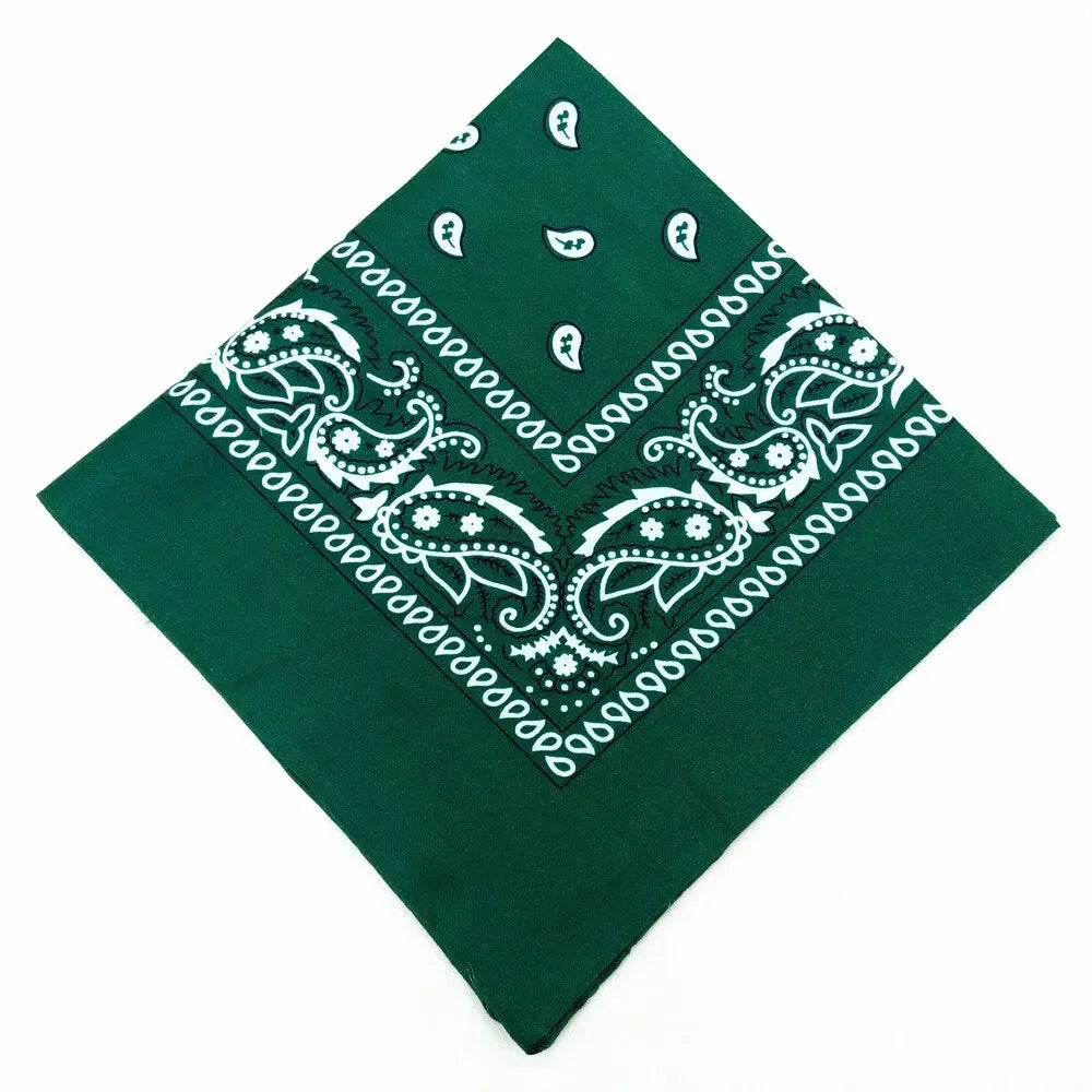 A dark green bandana featuring white paisley and floral patterns.
