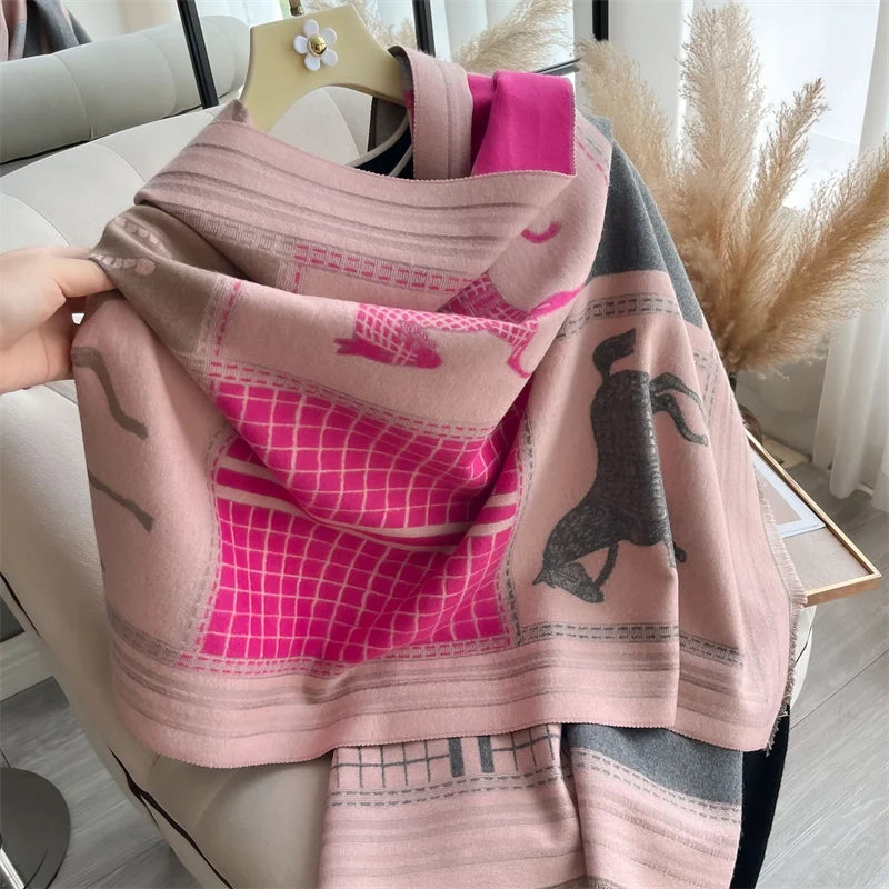 A pink and magenta plaid cashmere feel scarf draped over a light-colored sofa.