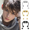 A young person models various gold and black hoop nose rings and stud earrings for fashion statement jewelry.