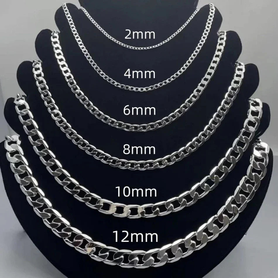 A display of various size geometric face chain necklaces made of 925 sterling silver.