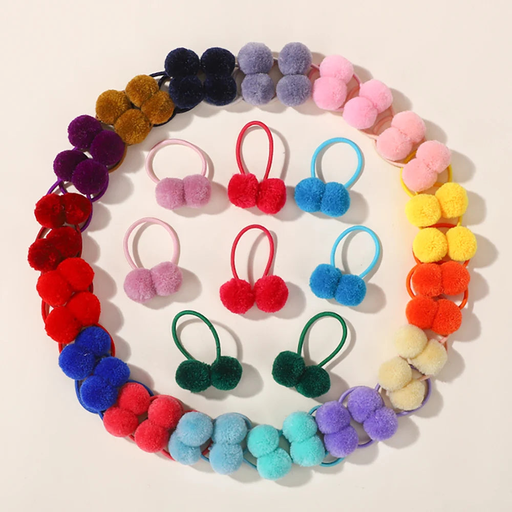 A circular arrangement of colorful double plush elastic hair bands for girls in various shades of purple, pink, yellow, and b