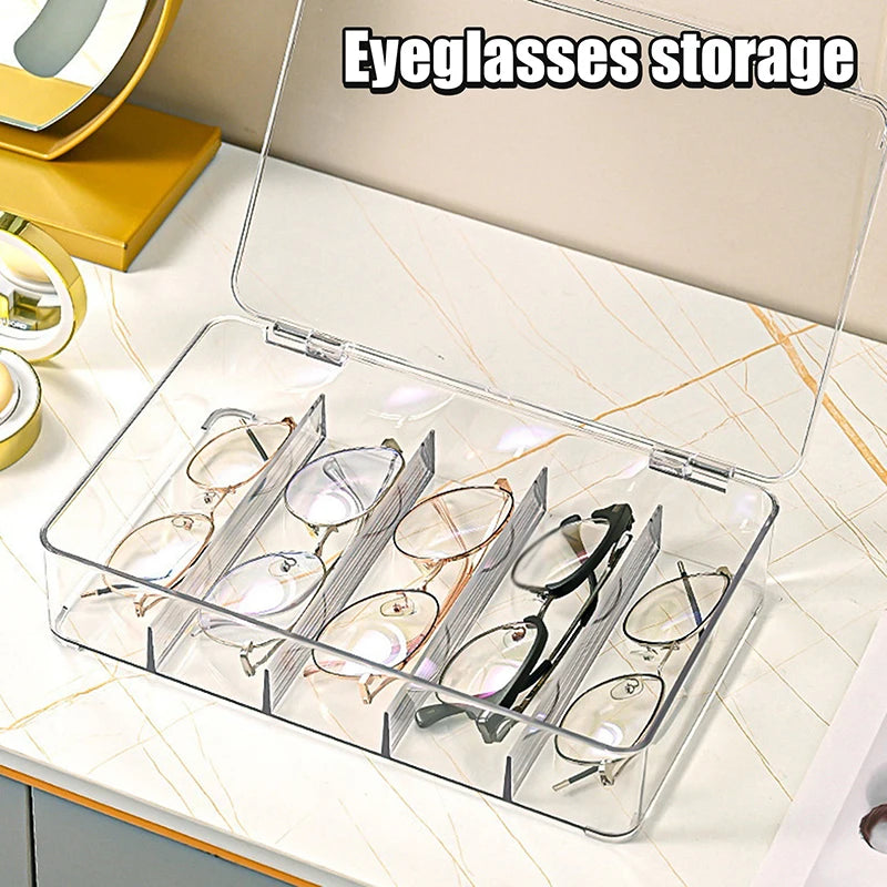 A clear plastic multi-compartment organizer for storing eyeglasses and sunglasses.