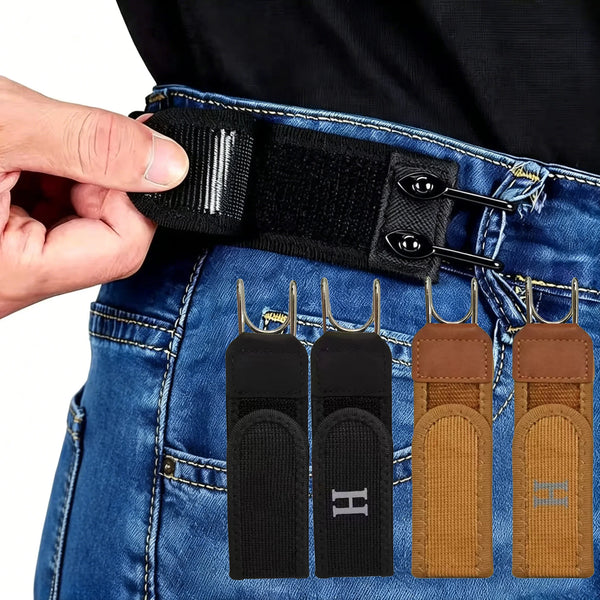 A hand is adjusting a black elastic waistband buckle set onto blue denim jeans.