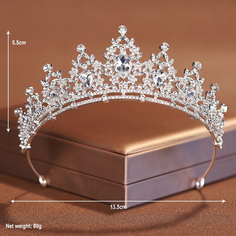 A sparkling crystal baroque bridal tiara headpiece displayed on a box with dimensions shown.
