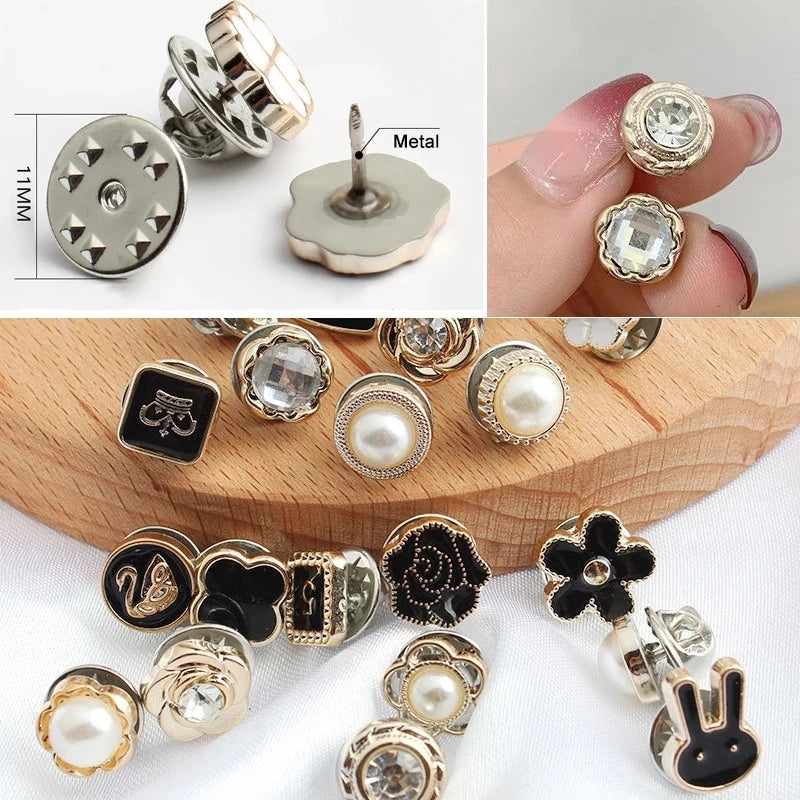 A collection of elegant button brooch pins featuring various designs including floral shapes, animals, and pearl accents.