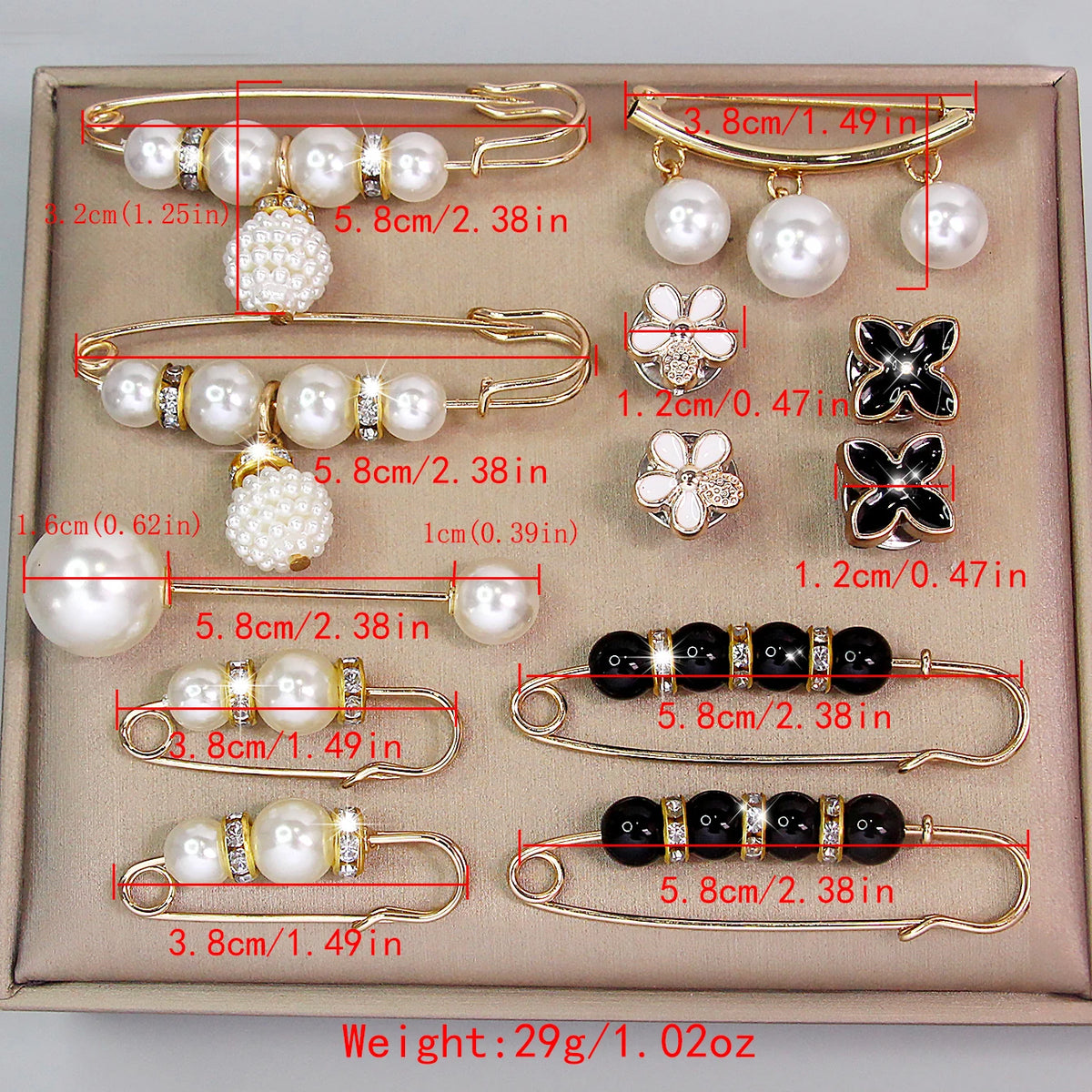 A set of adjustable pearl brooches and jewelry displayed on a light beige box.