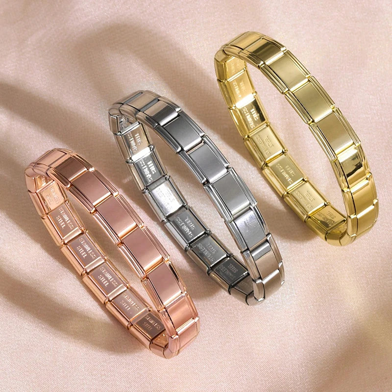 Three stainless steel charm bracelets in rose gold, silver, and gold tones displayed on a light background.