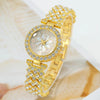 A gold-toned rhinestone quartz watch and bracelet set featuring a floral design on the watch face.