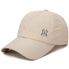 A beige unisex adjustable baseball cap featuring a dark embroidered interlocking NY logo.