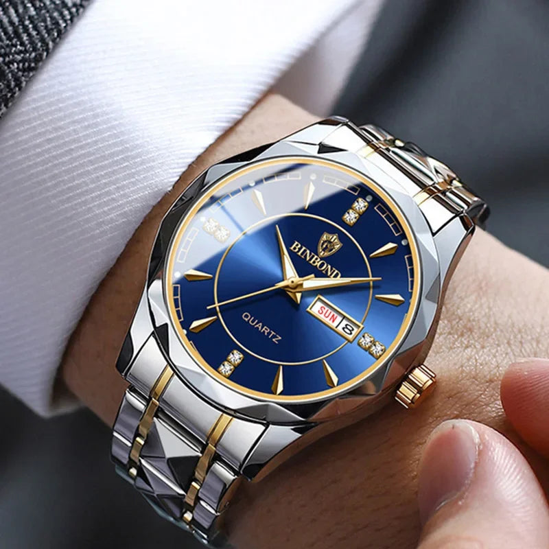 A close-up of a men's stainless steel quartz watch with a blue dial and gold accents worn on a wrist.
