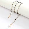 Gold-toned chains with black beads used as lanyards or necklaces