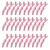 A set of pink professional multifunctional hair sectioning clips.
