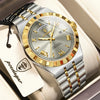 A silver and gold leather strap watch with a light gray face and gold accents resting in a box.