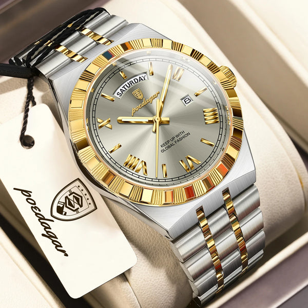 A silver and gold leather strap watch with a light gray face and gold accents resting in a box.