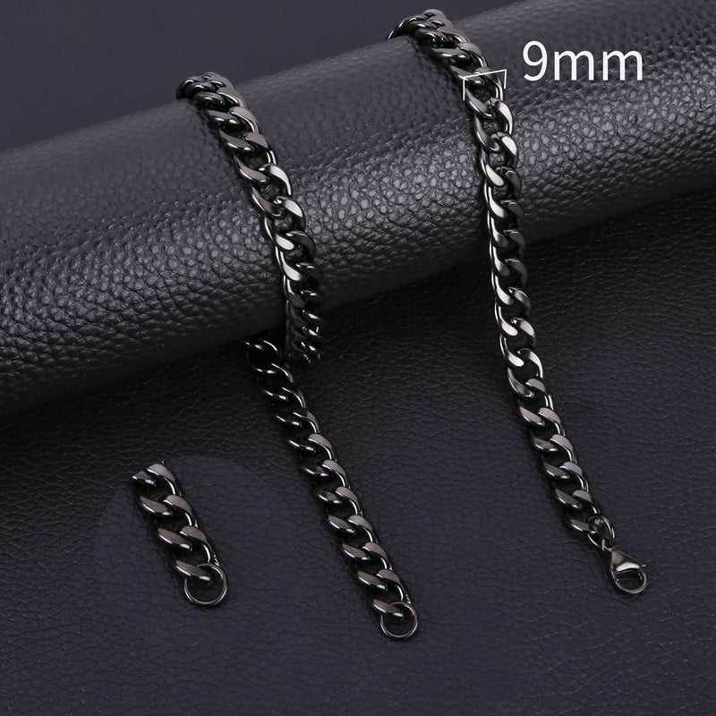 Two 9mm stainless steel Cuban link necklaces displayed on a dark surface.