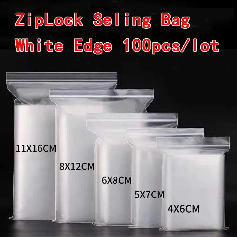 A collection of white edge ZipLock sealing bags in various sizes stacked on a dark surface.