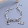 Sterling silver double heart charm bracelet with a chain and a $100 bill charm