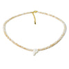 A delicate necklace made of mother of pearl beads with crystal accents, featuring a letter P pendant.