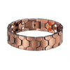 A copper magnetic therapy bracelet with hexagonal links and small white and orange accents.