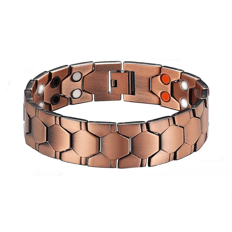 A copper magnetic therapy bracelet with hexagonal links and small white and orange accents.