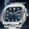 A close-up shot of a stainless steel watch with a blue dial and silver bracelet against a dark background.