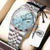 A silver-toned luxury quartz wristwatch with a light blue dial and stainless steel bracelet is displayed in a box.