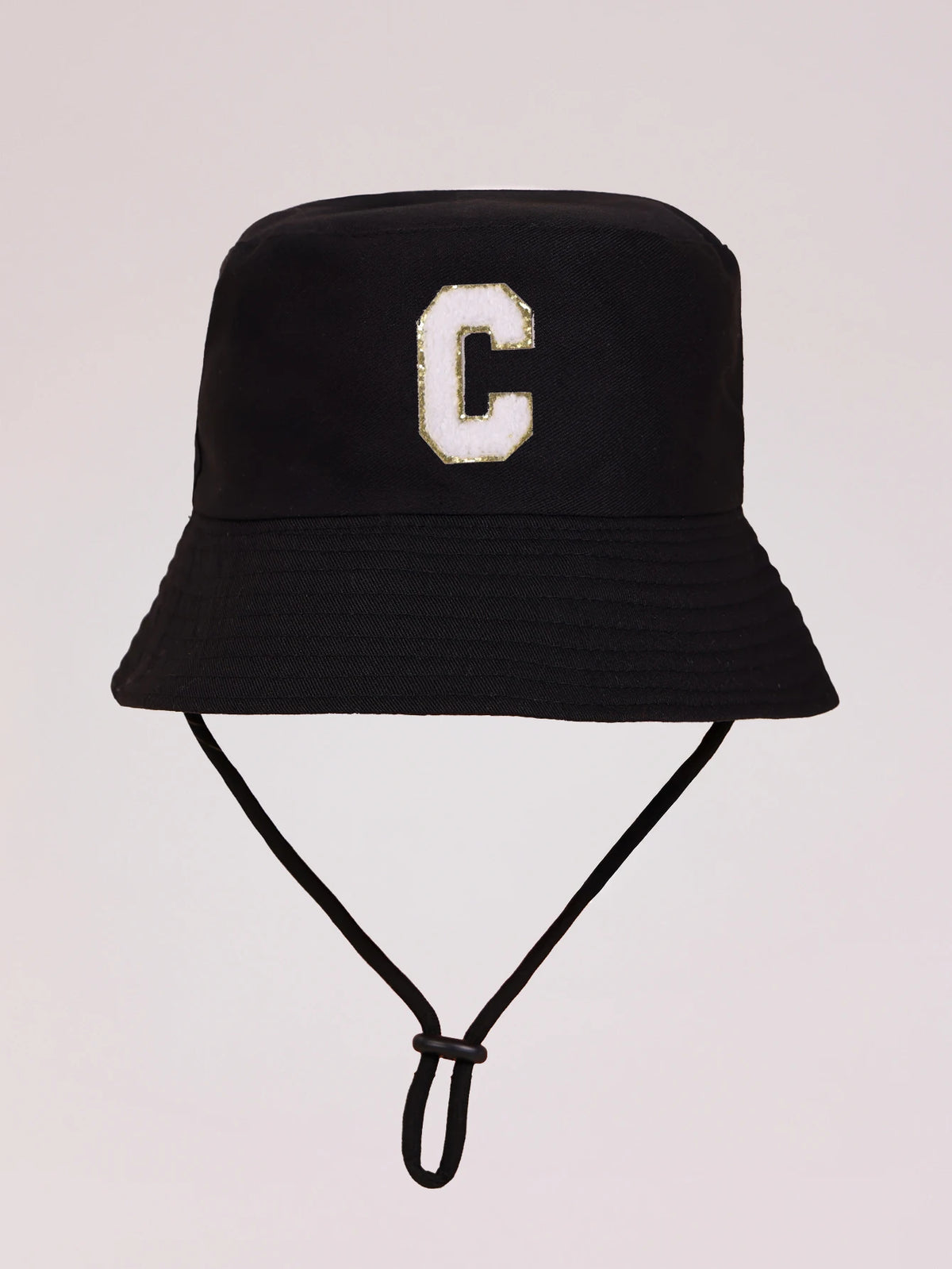 Black sun hat with a gold letter C print and an adjustable cord