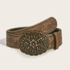 A vintage brown PU leather boho western belt with embossed floral detailing and gold-toned studs.