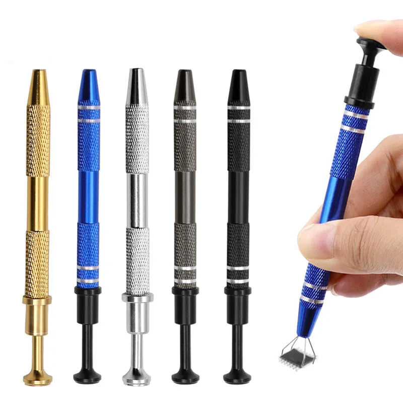 A hand holds a precision four-claw jewelry pick-up tool with a blue handle and metal claws.