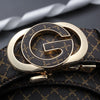 A close-up of a men's luxury faux leather plaid waist belt with a gold-toned buckle and black patterned leather.