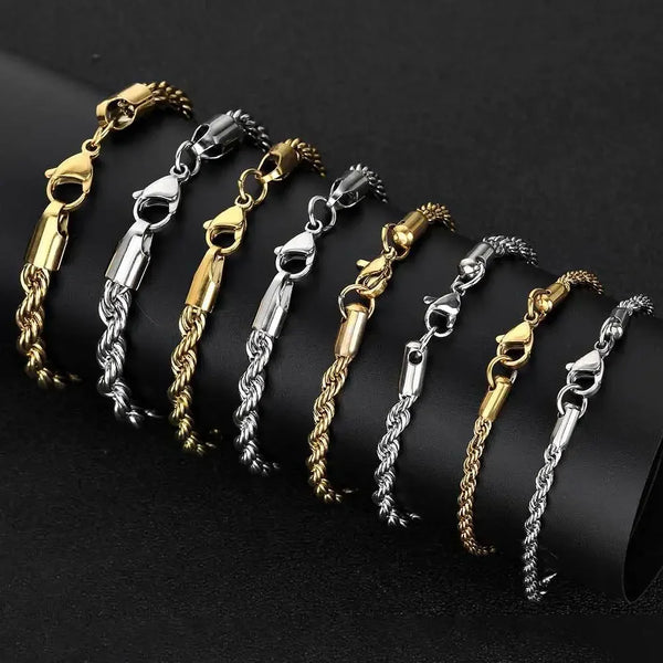 A display of multiple stainless steel twisted chain bracelets in gold and silver finishes.