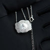Silver initial letter pendant necklace with a chain displayed on a black glove.