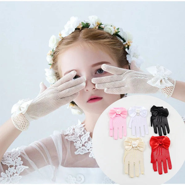 A young woman models bridal mesh finger gloves on her hand against a white background.