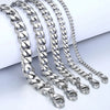 Silver stainless steel Cuban link bracelet chains displayed on a white background