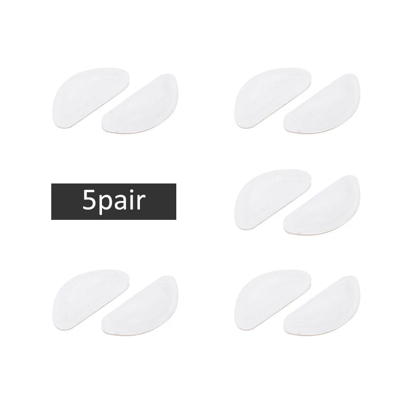 Five pairs of white silicone nose pads for eyeglasses