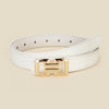 A white leather belt with a gold-toned buckle is shown lying flat.