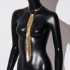 A gold crystal rhinestone sequin neck tie necklace displayed on a black mannequin.